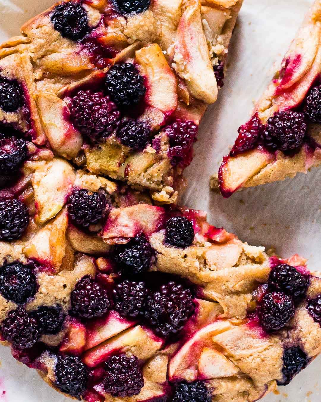 gluten free berry apple cake with a few slices cut out