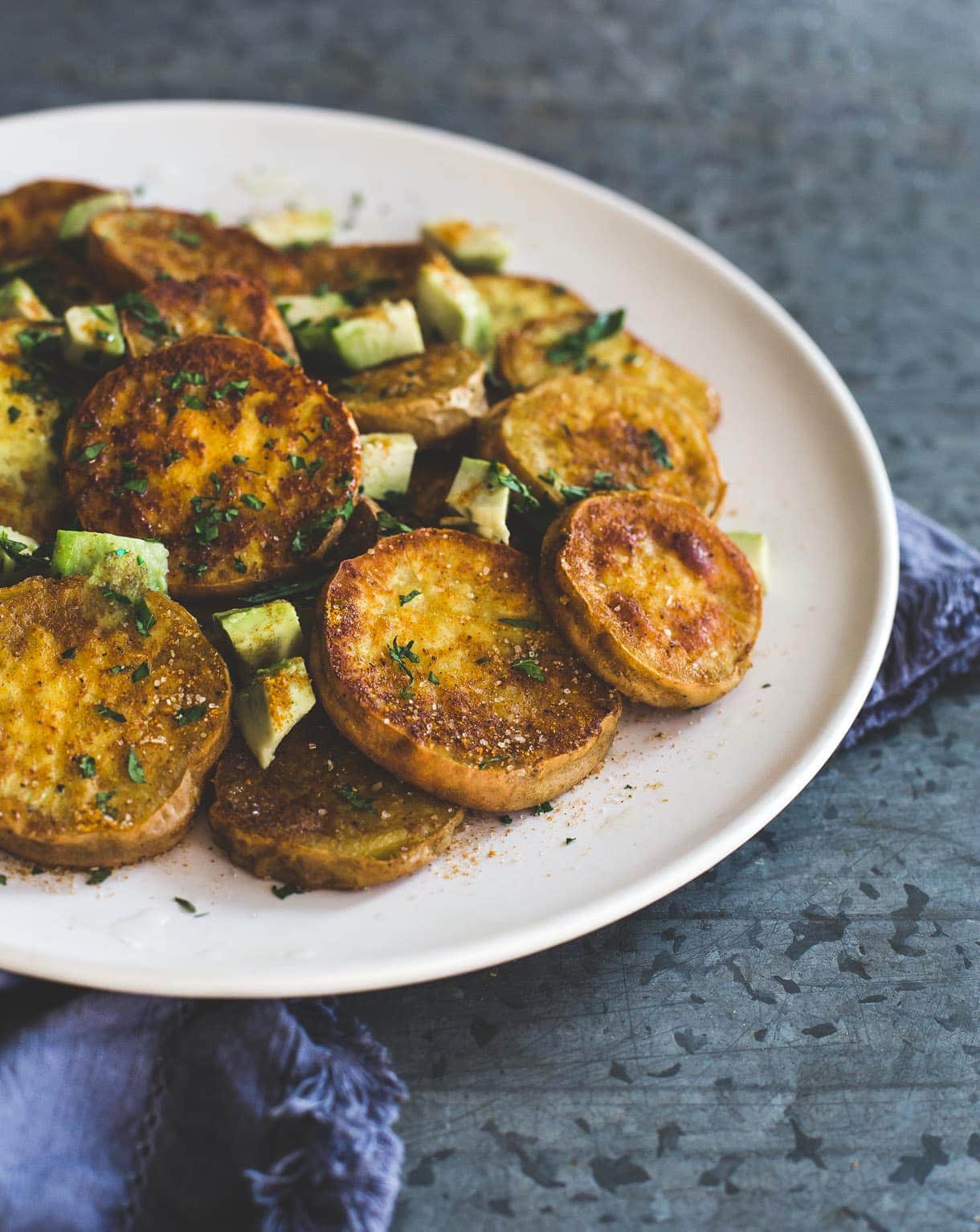 simple and addictive curry roasted white sweet potatoes, with avocado