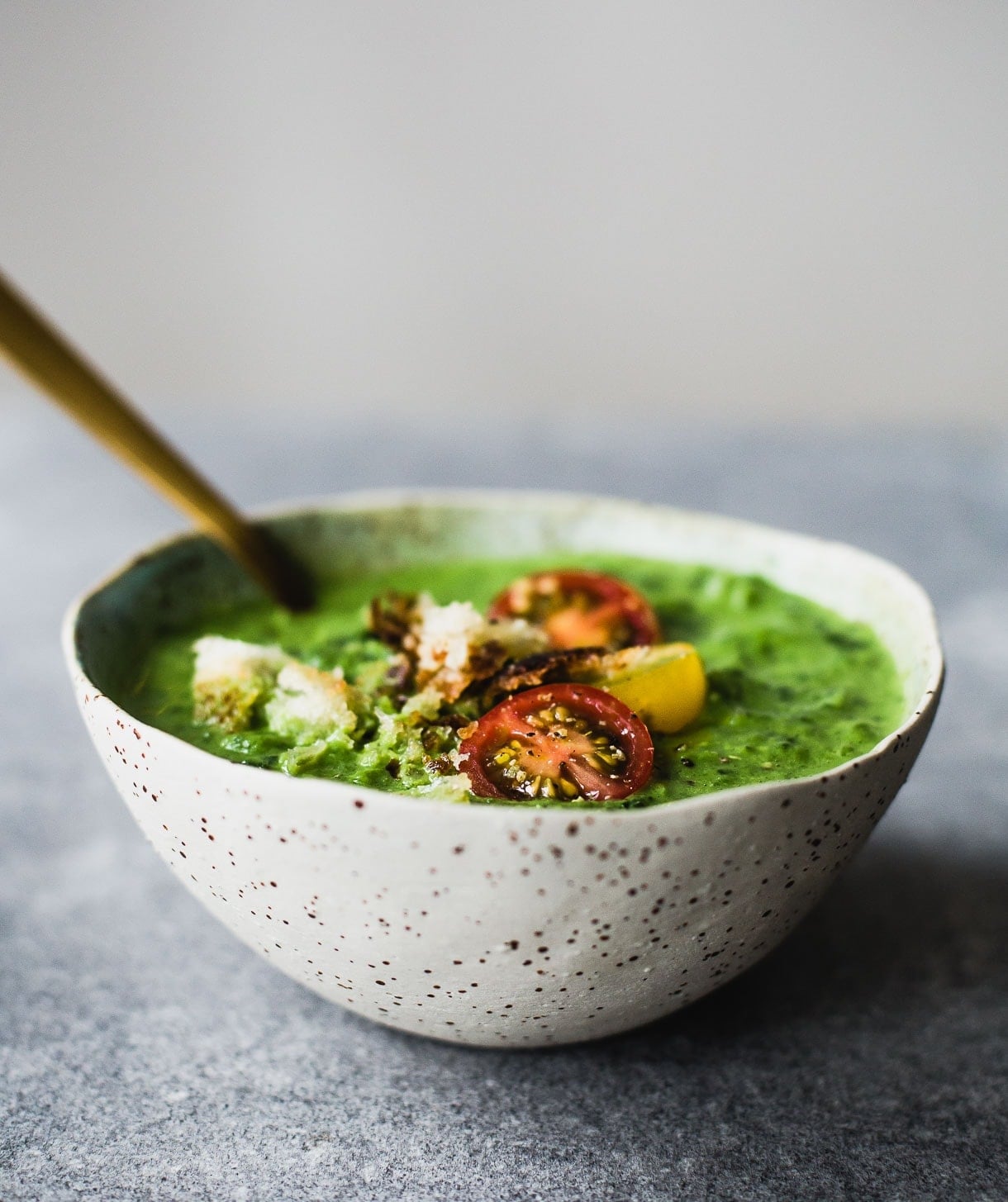 broccoli potato soup with tomatoes and crusty bread