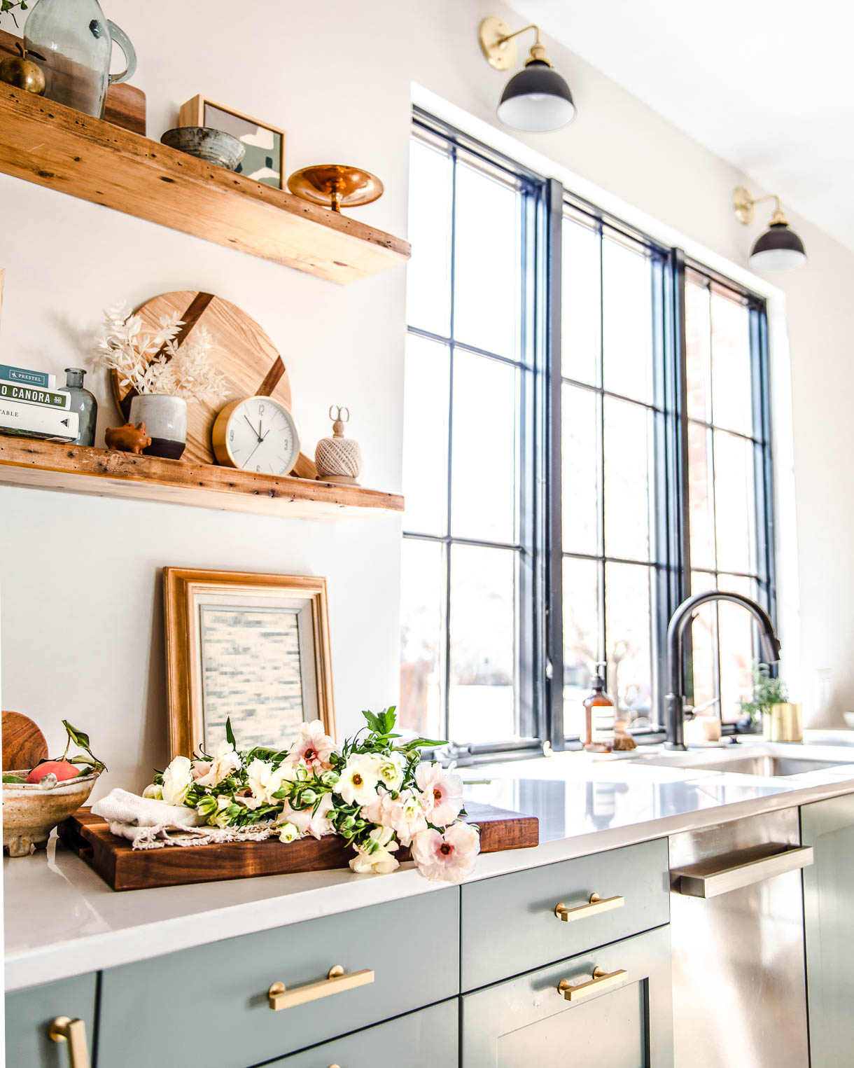frameless window in kitchen with flowers on a wooden cutting board