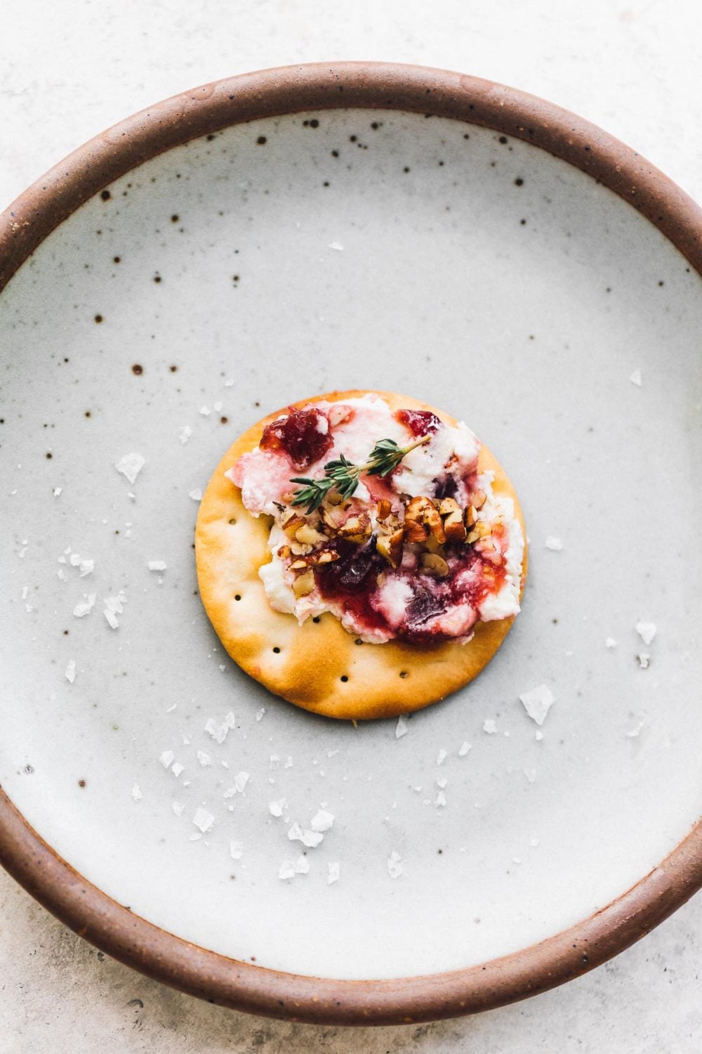 baked goat cheese and fig jam on a cracker