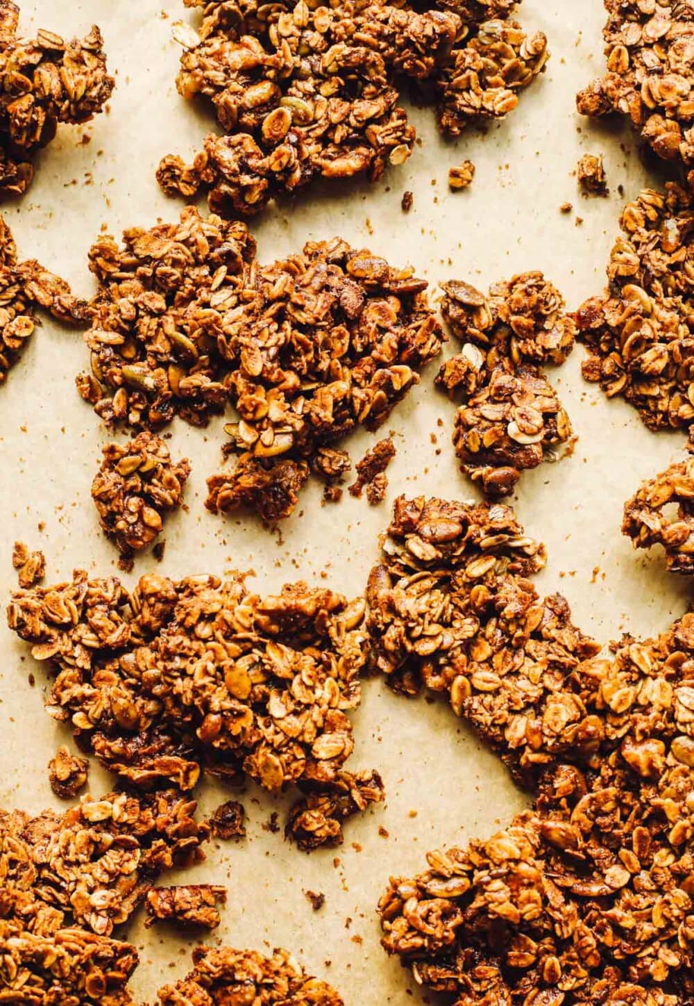 chunky granola on parchment paper