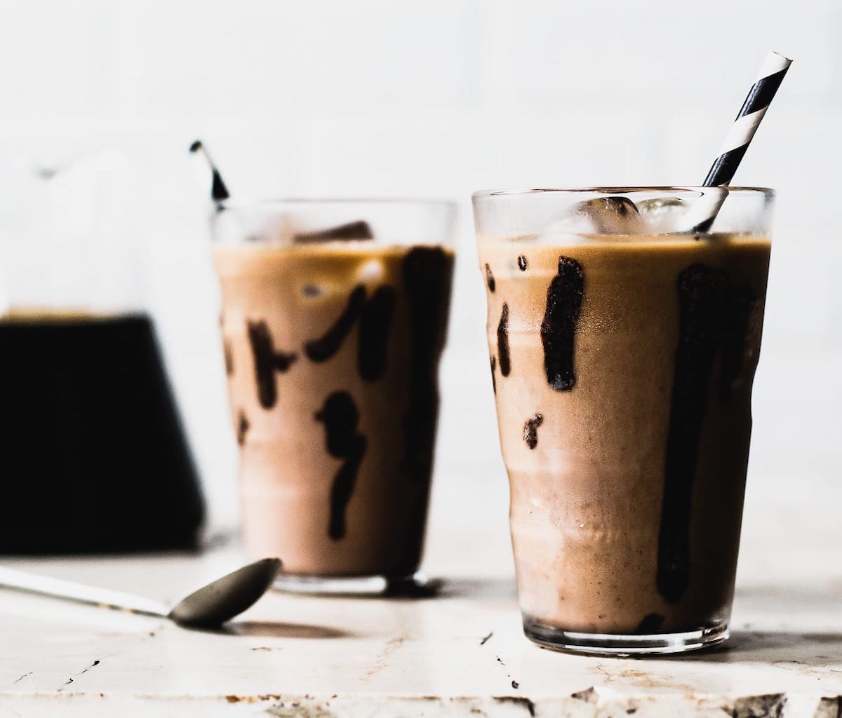 iced mocha in a clear glass with straw