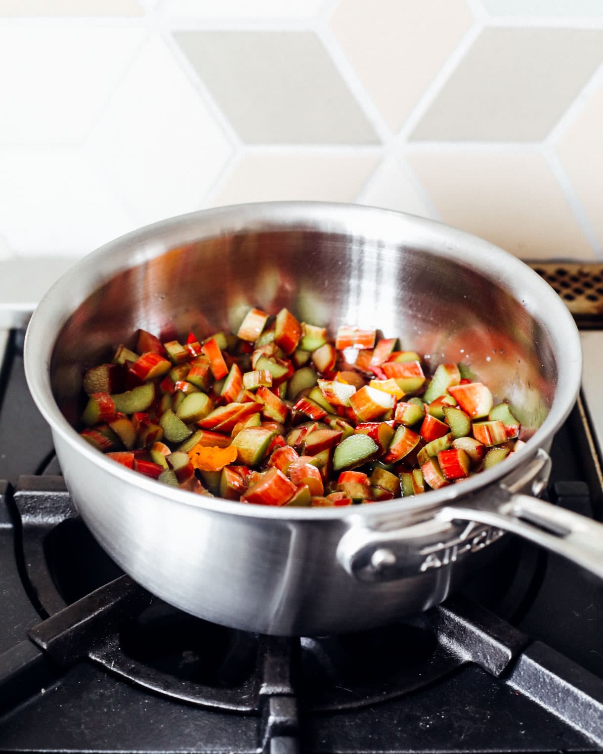 cooking rhubarb sauce in a steel pot