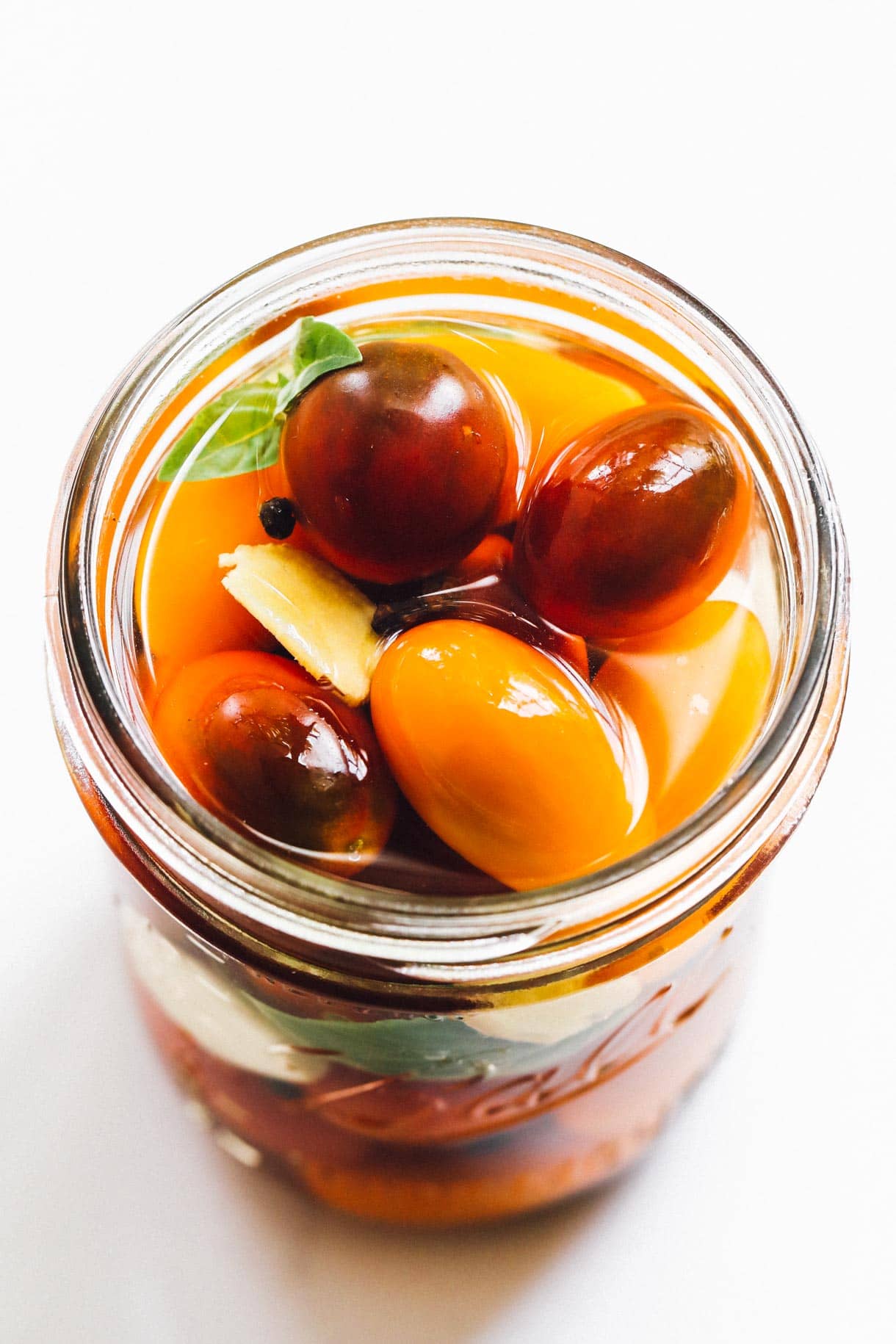 pickled cherry tomatoes in a glass jar