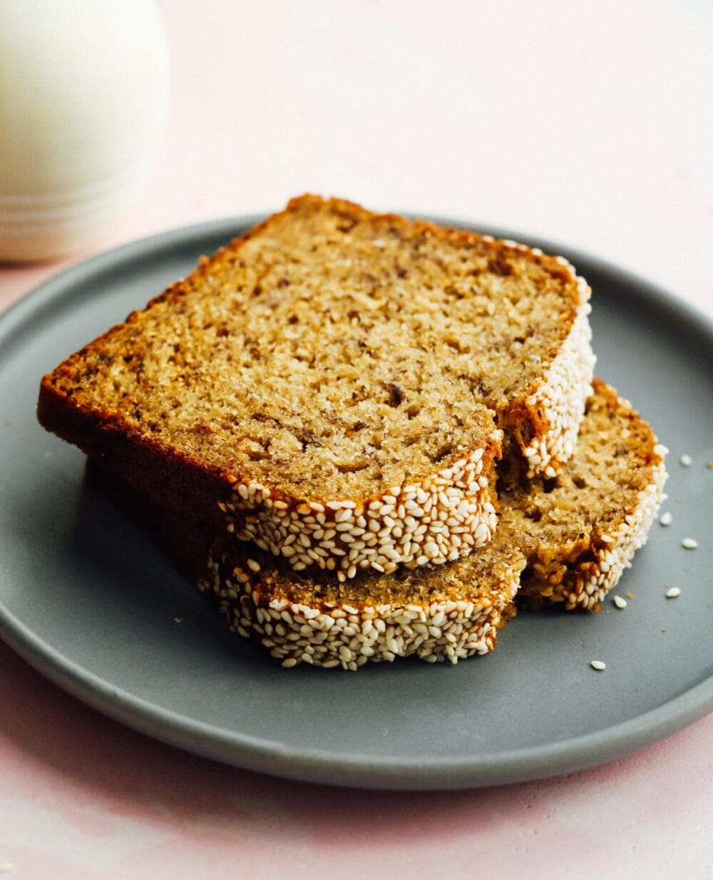 two slices of sourdough discard banana bread stacked on top of a blue plate