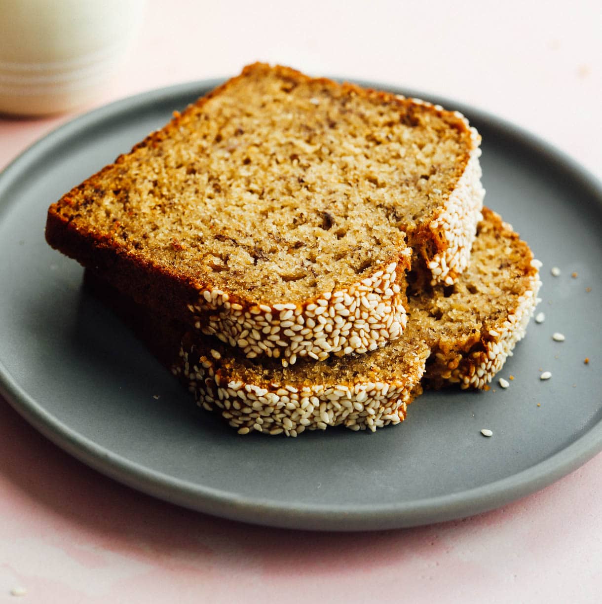 sourdough discard banana bread slices stacked on blue plate