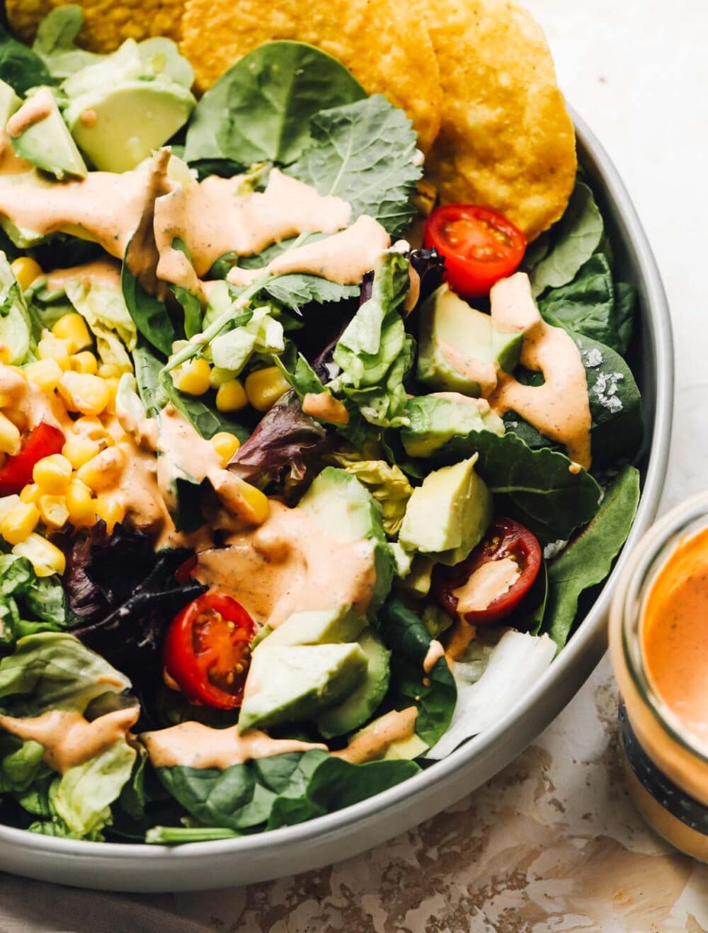 southwest salad dressing on a salad in a bowl