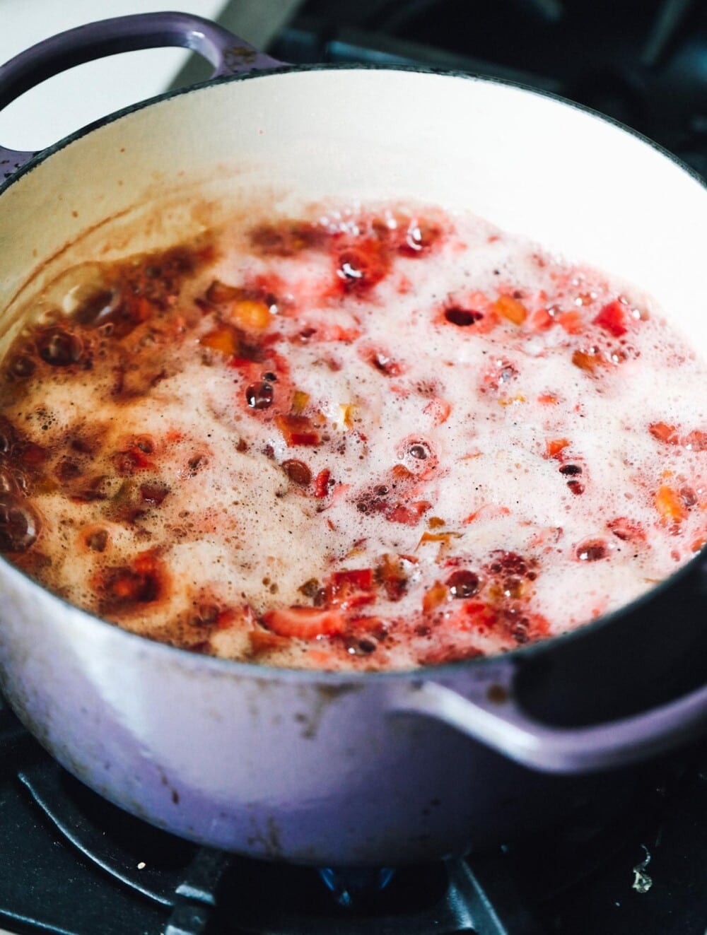 strawberry rhubarb jam cooking in a pot