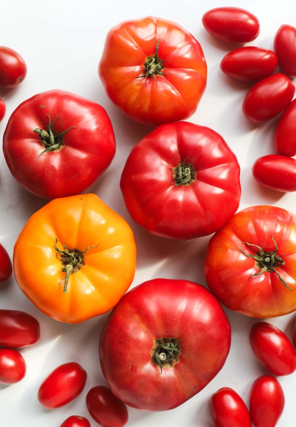 heirloom tomatoes on a white surface