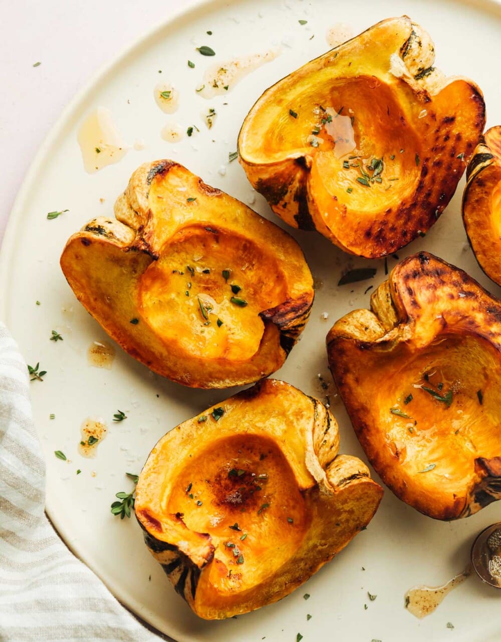 roasted sweet dumpling squash on white plate