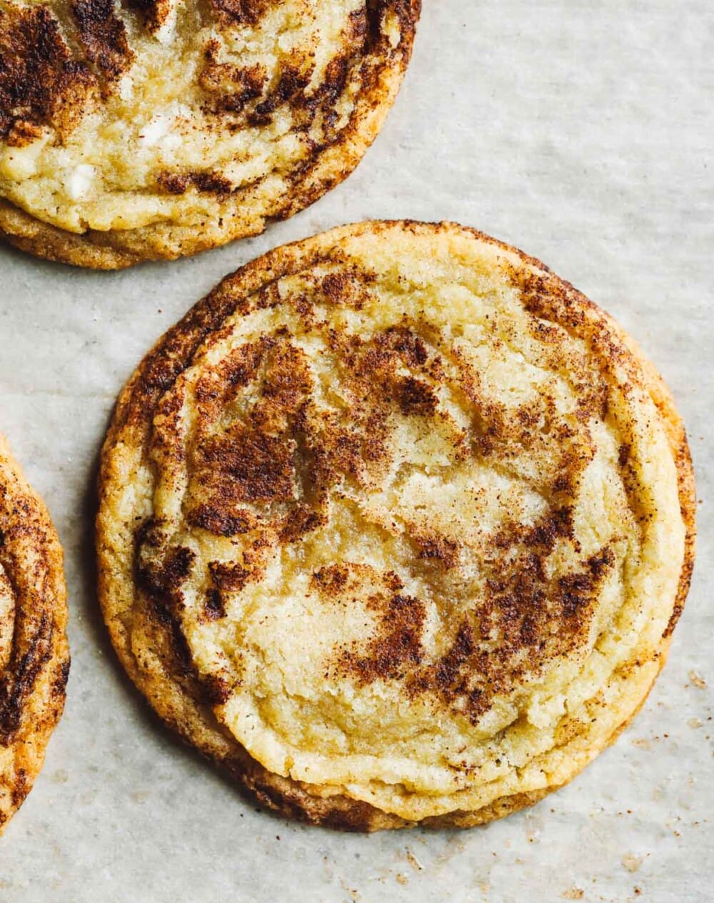 gluten free snickerdoodles on white parchment paper