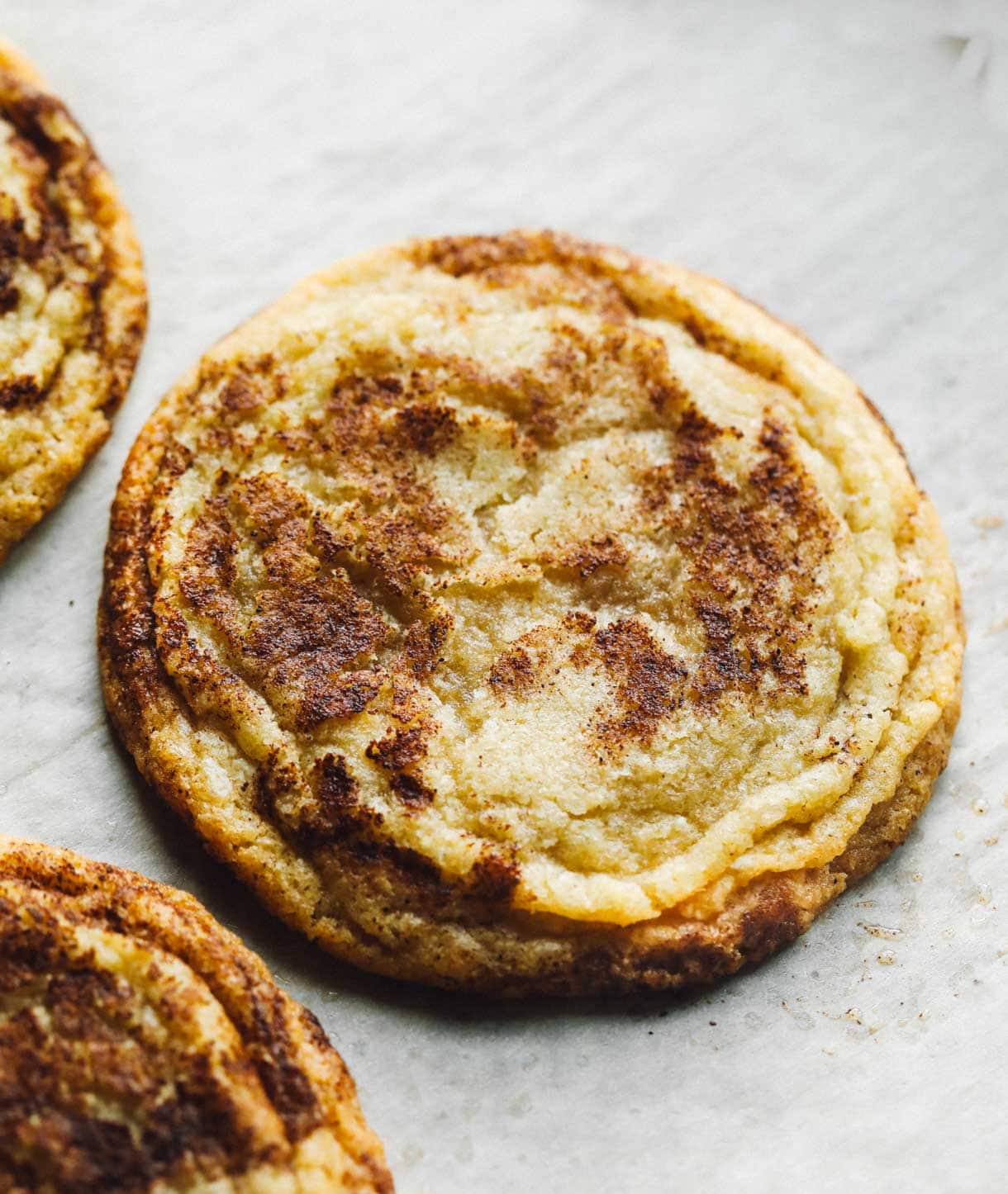 gluten free snickerdoodles on parchment paper