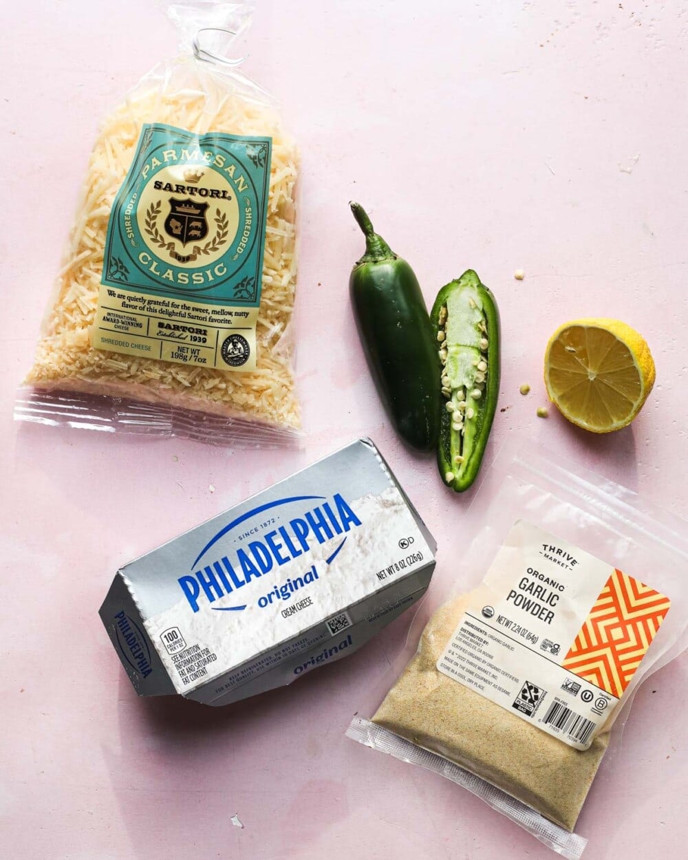ingredients for making jalapeno cream cheese on a pink backround