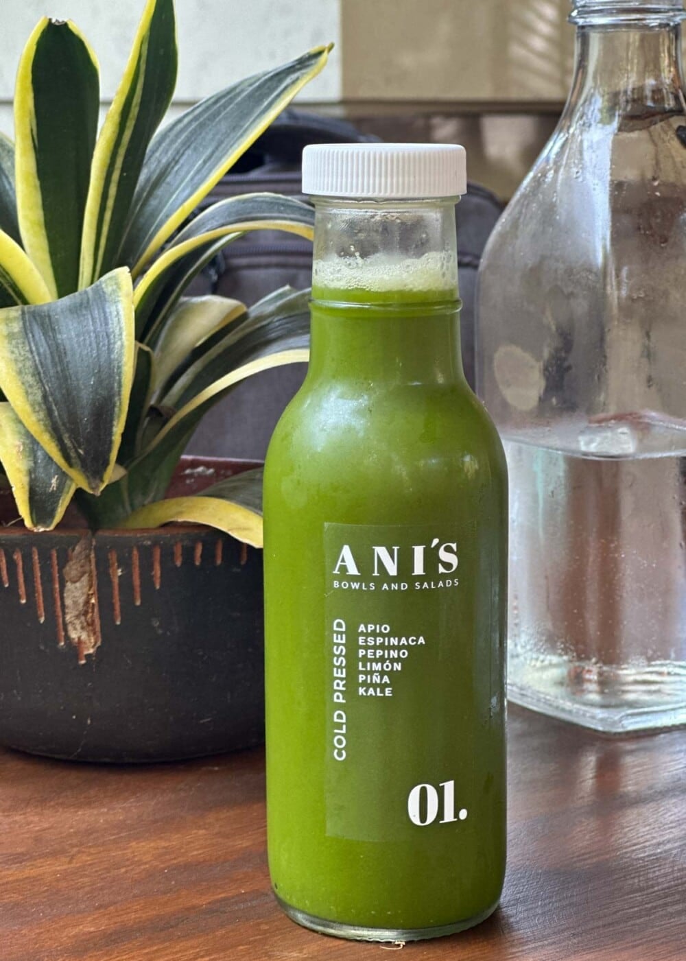 green juice in glass bottle