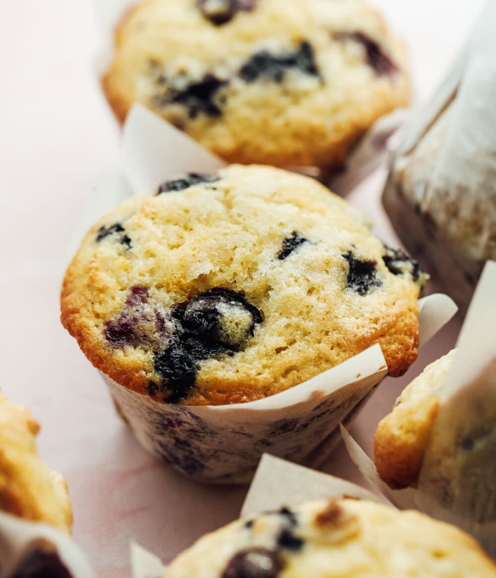 blueberry sourdough muffins in white liners