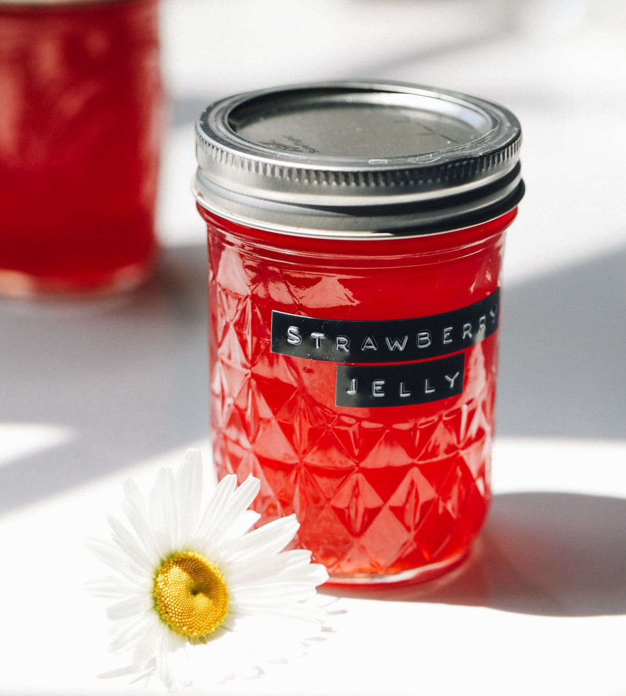 strawberry jelly in a quilted mason jar