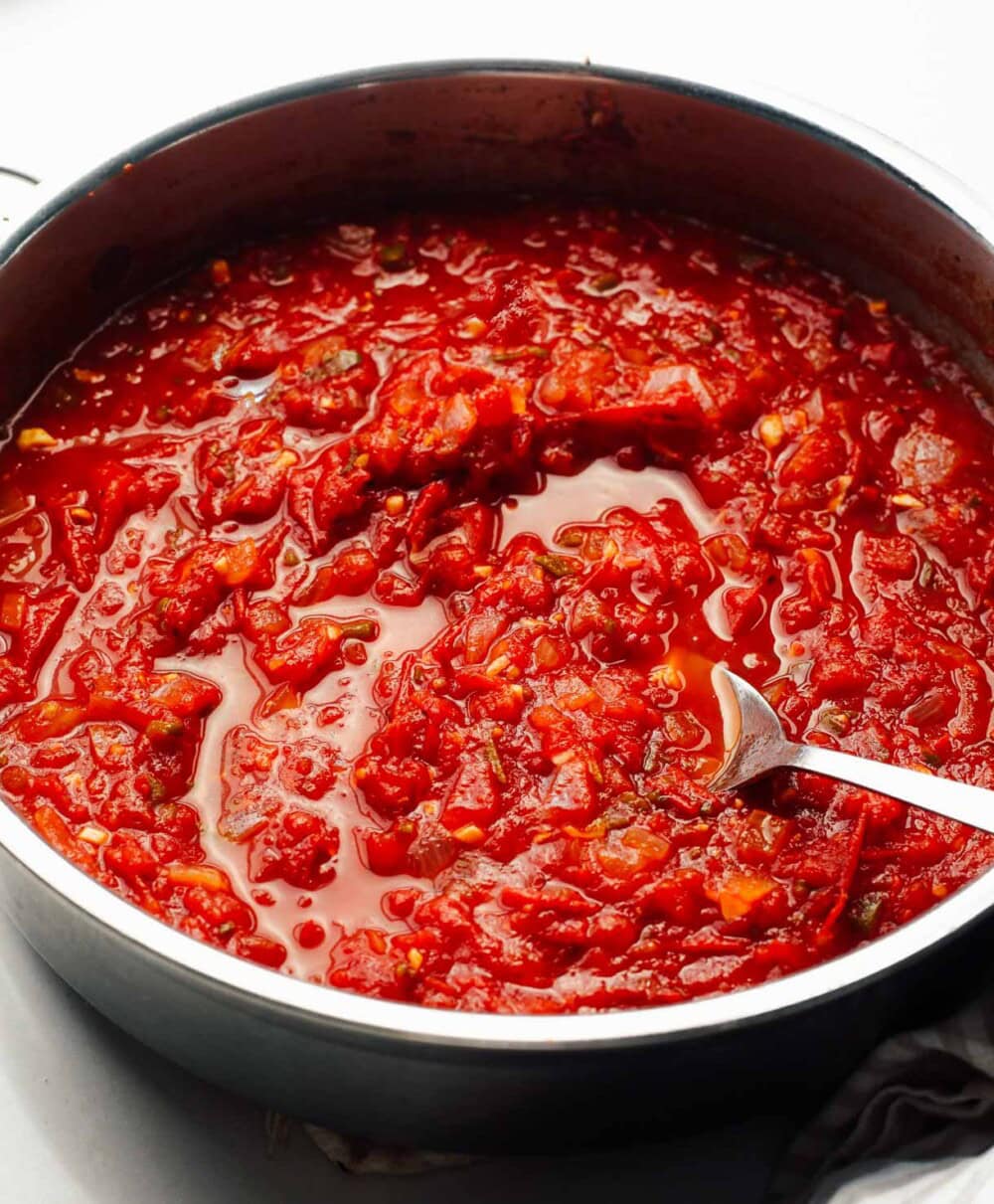 stewed tomatoes in steel saucepan