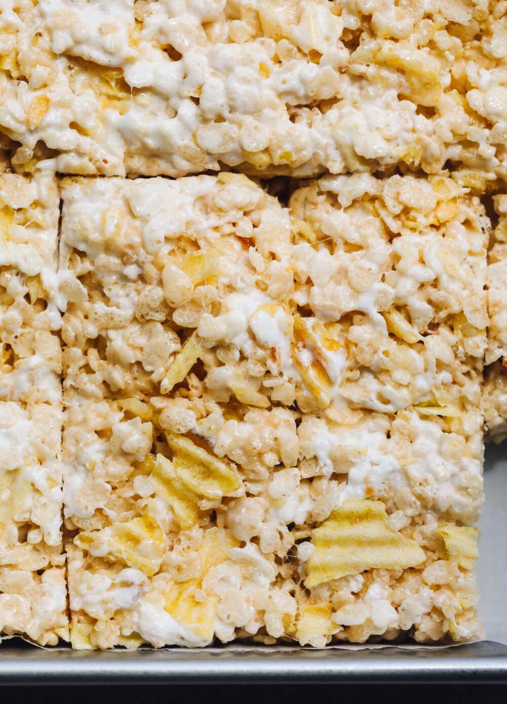 potato chip rice krispie treats cut in a metal pan